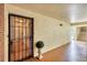 A secure front entrance with a decorative security door and a charming welcome mat and manicured plant at 6188 80Th N St # 102, St Petersburg, FL 33709
