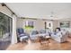 Inviting living room featuring hardwood floors, a neutral color palette, and ample natural light with lake views at 6188 80Th N St # 102, St Petersburg, FL 33709