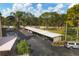 Well-maintained covered parking area for residents and guests, nestled amidst lush landscaping and mature trees at 6188 80Th N St # 102, St Petersburg, FL 33709