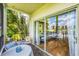 Serene patio with seating area offering views of the beautiful lake and nature at 6188 80Th N St # 102, St Petersburg, FL 33709
