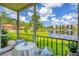 Screened in patio with peaceful views of the lake and community in a well-maintained area with beautiful landscaping at 6188 80Th N St # 102, St Petersburg, FL 33709