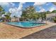 Community pool and patio area with brick pavers and lounge chairs, perfect for relaxation and enjoying sunny days at 6188 80Th N St # 102, St Petersburg, FL 33709