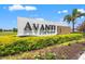Attractive Avanti at Waterside community entrance sign with lush landscaping and manicured flowerbeds at 6612 Silverstar Dr, Sarasota, FL 34240