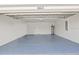 Spacious two car garage featuring an epoxy floor at 6612 Silverstar Dr, Sarasota, FL 34240