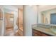 Bright bathroom showcasing stone floors, a tub, and a designer sink and vanity at 6905 Pine Valley St, Bradenton, FL 34202