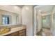 Bathroom featuring a designer sink and access to a shower and separate bath area at 6905 Pine Valley St, Bradenton, FL 34202