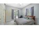 Bedroom showcasing a chair, view, ceiling fan, and easy access to outdoor living at 6905 Pine Valley St, Bradenton, FL 34202