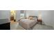 Bedroom featuring a comfy bed, bedside tables, and access to the ensuite bathroom at 6905 Pine Valley St, Bradenton, FL 34202