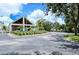 Community clubhouse with golf carts and golf course, offering leisure, recreation, and convenience for residents at 6905 Pine Valley St, Bradenton, FL 34202