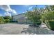 Elegant home featuring a driveway with beautiful landscaping and a well-maintained lawn that create great curb appeal at 6905 Pine Valley St, Bradenton, FL 34202