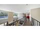 Hallway featuring an open floor plan, high ceilings, and views to the first floor at 6905 Pine Valley St, Bradenton, FL 34202