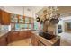 Gourmet kitchen with granite countertops, an island cooktop, and ample cabinet space for storage at 6905 Pine Valley St, Bradenton, FL 34202