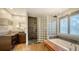 This main bathroom features dual sinks, a glass block shower, and a soaking tub at 6905 Pine Valley St, Bradenton, FL 34202