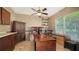 Home office features multiple workspaces, built-in shelving, and a bright window at 6905 Pine Valley St, Bradenton, FL 34202