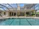 Expansive screened-in pool area with ample patio space, ideal for outdoor entertaining and enjoying the beautiful surroundings at 6905 Pine Valley St, Bradenton, FL 34202