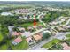Aerial view of home in a cul-de-sac with mature trees and lush landscaping in a desirable neighborhood at 7115 39Th E Ln, Sarasota, FL 34243