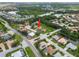 Aerial view of home showing mature trees and lush landscaping, situated on a waterfront property with an attractive neighborhood at 7115 39Th E Ln, Sarasota, FL 34243