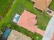 Aerial view of a home with a private screened in pool and meticulously maintained landscaping at 7115 39Th E Ln, Sarasota, FL 34243