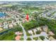 Wide aerial shot displaying a neighborhood with ponds, well-maintained lawns, and a community of inviting homes at 7115 39Th E Ln, Sarasota, FL 34243