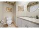 Bright bathroom with a white vanity, decorative wallpaper border, and beautiful framed art for an inviting atmosphere at 7115 39Th E Ln, Sarasota, FL 34243