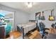Comfortable bedroom with a cozy rug and a desk setup, ideal for work or study at 7115 39Th E Ln, Sarasota, FL 34243