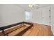 Bright, empty bedroom with hardwood floors and a ceiling fan at 7115 39Th E Ln, Sarasota, FL 34243