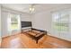 Bright, empty bedroom with hardwood floors and lots of natural light at 7115 39Th E Ln, Sarasota, FL 34243