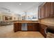 Open kitchen with granite countertops, stainless steel appliances, and a seamless transition to the living area at 7115 39Th E Ln, Sarasota, FL 34243