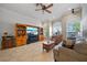Inviting living room features tile floors, natural light, and a cozy seating arrangement for relaxation at 7115 39Th E Ln, Sarasota, FL 34243