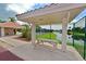 Community picnic area with a sheltered table, adjacent to a pool and a scenic view of the tranquil lake at 7115 39Th E Ln, Sarasota, FL 34243