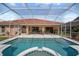 Enclosed pool and spa area provides a private and enjoyable outdoor living space perfect for relaxation and recreation at 7115 39Th E Ln, Sarasota, FL 34243