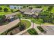 Breathtaking aerial view of the clubhouse, golf course and lake at 7130 Westhill Ct, Lakewood Ranch, FL 34202