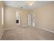 Large bedroom with neutral walls and carpet and views to the bathroom at 7130 Westhill Ct, Lakewood Ranch, FL 34202