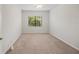 Carpeted bedroom with natural light provides a serene atmosphere at 7130 Westhill Ct, Lakewood Ranch, FL 34202
