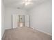 Bright bedroom featuring neutral carpet and direct access to an additional room at 7130 Westhill Ct, Lakewood Ranch, FL 34202
