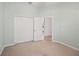 Carpeted bedroom featuring built in closet and views of the kitchen at 7130 Westhill Ct, Lakewood Ranch, FL 34202