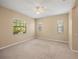 Large bedroom featuring natural light, neutral colors, and a ceiling fan at 7130 Westhill Ct, Lakewood Ranch, FL 34202