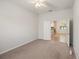 Bedroom featuring plush carpeting with views into the kitchen at 7130 Westhill Ct, Lakewood Ranch, FL 34202