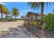 The clubhouse has lush landscaping and a stone facade at 7130 Westhill Ct, Lakewood Ranch, FL 34202