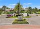 Inviting entrance to The Retreat with lush landscaping and a welcoming roundabout at 7130 Westhill Ct, Lakewood Ranch, FL 34202