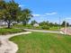 Lush landscaping and a sign adorn the entrance to The Lodge at 7130 Westhill Ct, Lakewood Ranch, FL 34202