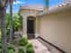Inviting front entrance with a brick pathway and lush landscaping at 7130 Westhill Ct, Lakewood Ranch, FL 34202