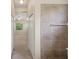 Hallway with tile accent, leading to a room with ample natural light at 7130 Westhill Ct, Lakewood Ranch, FL 34202