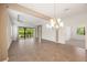 Spacious living room with abundant natural light and tile floors throughout at 7130 Westhill Ct, Lakewood Ranch, FL 34202