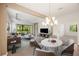 Staged living room showcases the generous space, natural light, and cozy design elements at 7130 Westhill Ct, Lakewood Ranch, FL 34202