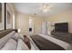 Stylish main bedroom with comfortable bed, TV, and ensuite bathroom view at 7130 Westhill Ct, Lakewood Ranch, FL 34202
