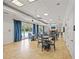 Well-appointed room featuring tables, chairs and access to the pool area at 7130 Westhill Ct, Lakewood Ranch, FL 34202