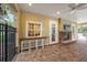 A beautifully pavered outdoor patio with fireplace and built-in barstool seating at 7130 Westhill Ct, Lakewood Ranch, FL 34202