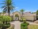 View of the neighborhood clubhouse entrance leading to the community pool at 7130 Westhill Ct, Lakewood Ranch, FL 34202