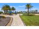 Large pool deck with pool, lounge chairs, and well-manicured lawn at 7130 Westhill Ct, Lakewood Ranch, FL 34202